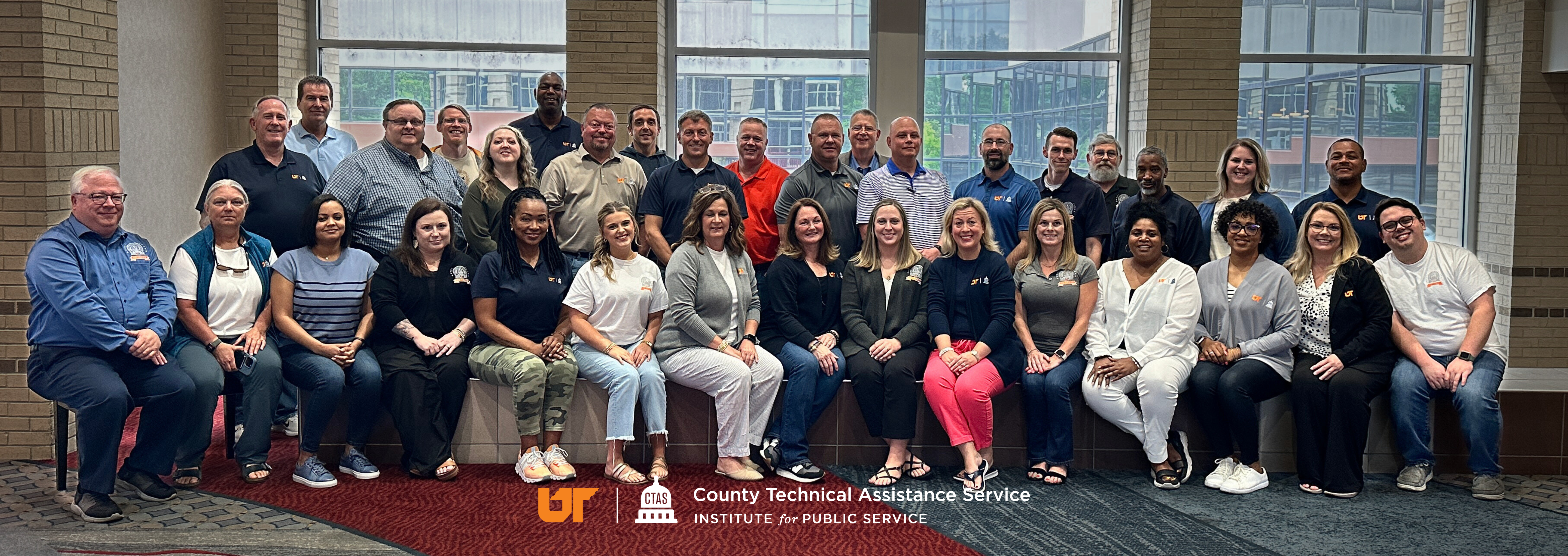 CTAS staff sitting inside for a group photo.